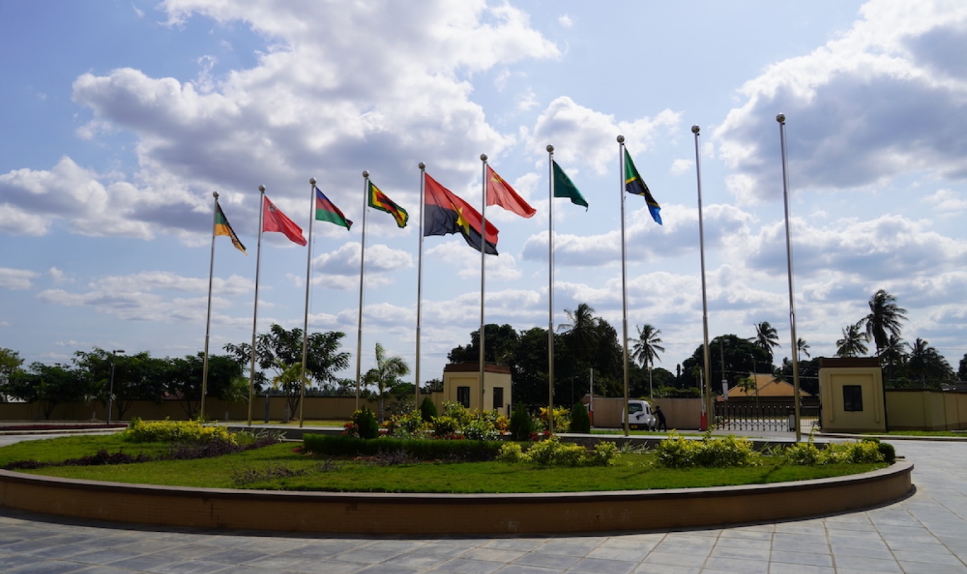 Eight flags fly in front of the school’s entrance