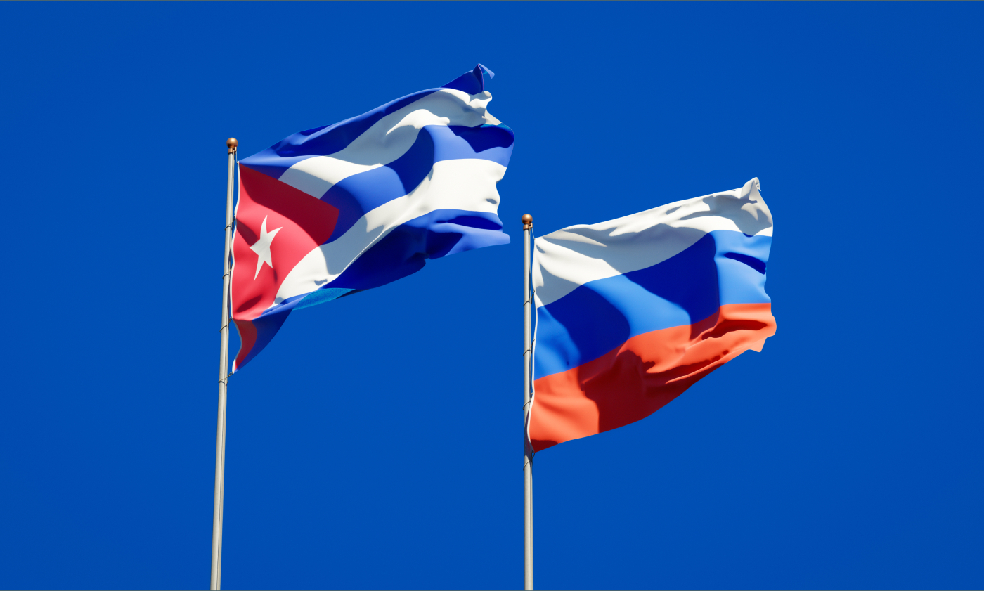 Flags of Cuba and Russia on flagpoles