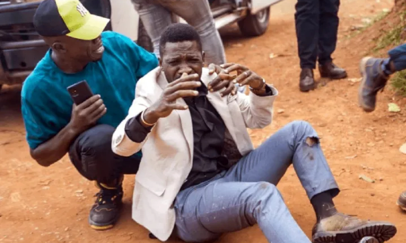 Bobi Wine on the ground after being shot