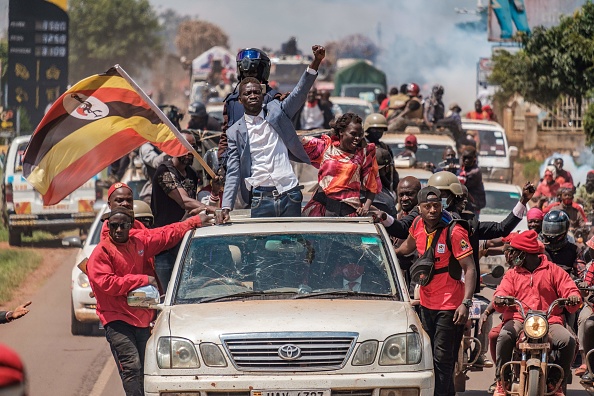 Bobi Wine greets supporters as he sets off on his campaign trail towards eastern Uganda